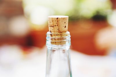 Close-up of glass bottle on table