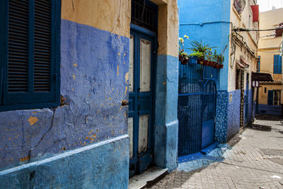 Empty alley amidst buildings in city