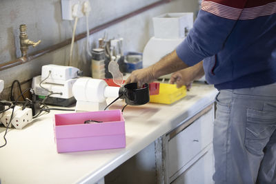 Midsection of woman working at home