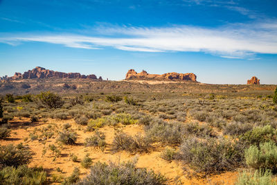 Rock formations on landscape against sky