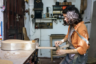 Side view of woman working