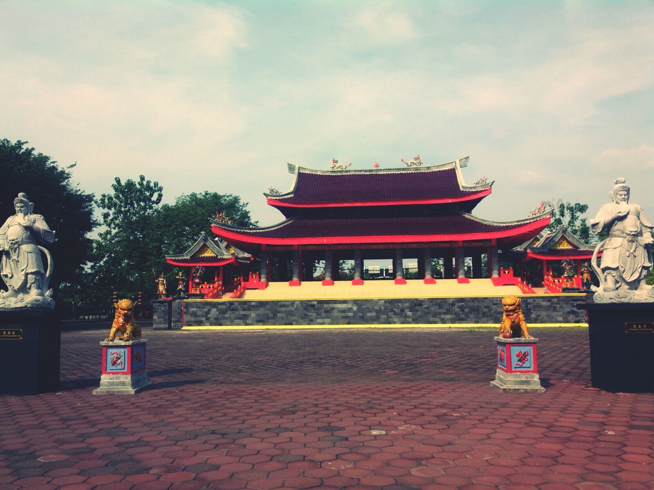 temple - building, religion, sky, red, place of worship, built structure, architecture, spirituality, tradition, cultures, cloud - sky, building exterior, temple, tree, shrine, culture, pagoda, travel destinations, famous place