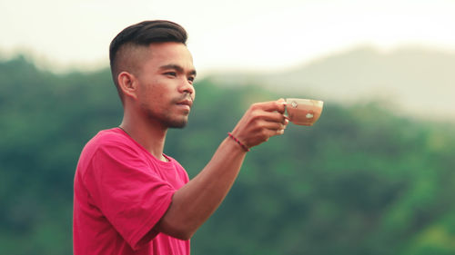 Portrait of young man looking away