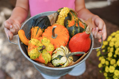 Cropped hand of woman holding food