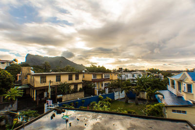 Houses in town against sky