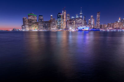 Illuminated buildings in city at night