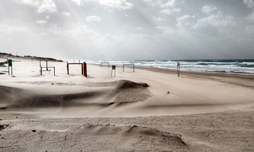 Scenic view of beach against sky