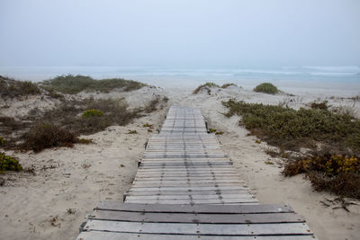 Pier over sea against sky