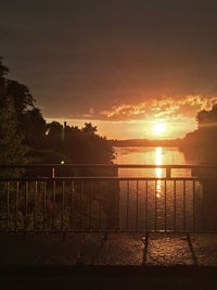 Silhouette of fence at sunset