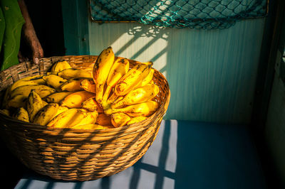 High angle view of fruits in basket on table at home