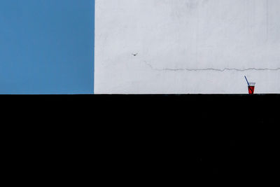 Low angle view of building against clear blue sky