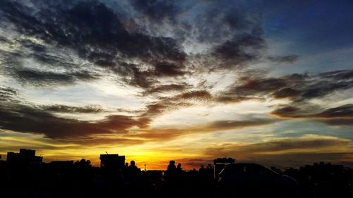 Silhouette of city at sunset