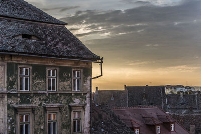 Exterior of old building in city against sky