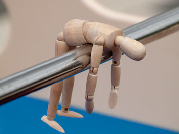 Close-up of hand holding chain