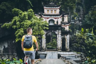 Rear view of man walking in city