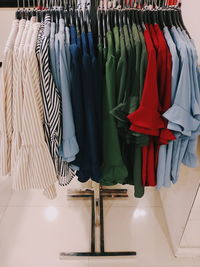 Clothes hanging on rack in store