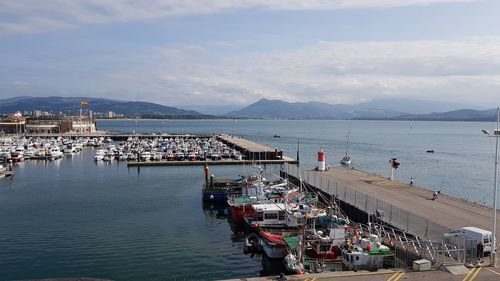 High angle view of sailboats moored at harbor