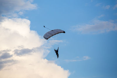 Low angle view of kite flying against sky