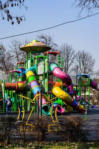 View of playground in park against sky