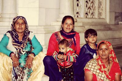 Portrait of family sitting outdoors