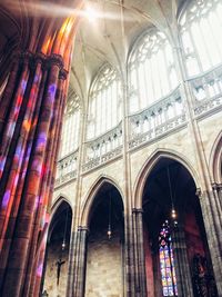 Low angle view of stained glass window in historic building