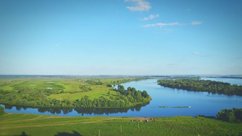 Scenic view of landscape against blue sky