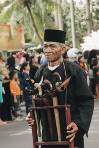 Portrait of man standing on street