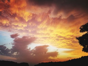Low angle view of dramatic sky during sunset