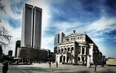 Low angle view of building against cloudy sky