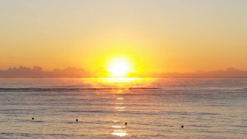 Scenic view of sea against clear sky during sunset