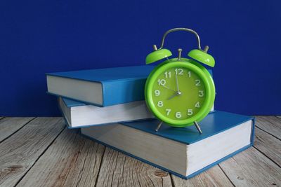 Close-up of clock on table
