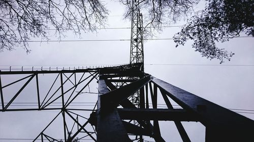 Low angle view of cables against clear sky
