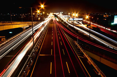 High angle view of light trails on road at night