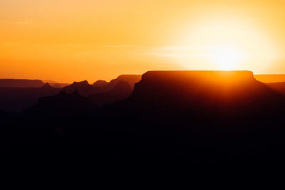 Silhouette rock formations against sky during sunset at grand canyon national park