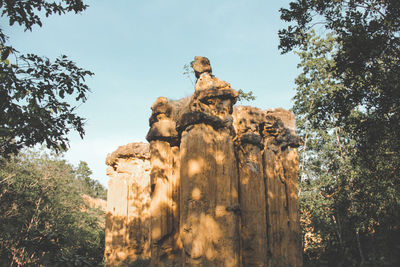 Low angle view of statue against sky