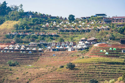 High angle view of trees and houses against sky