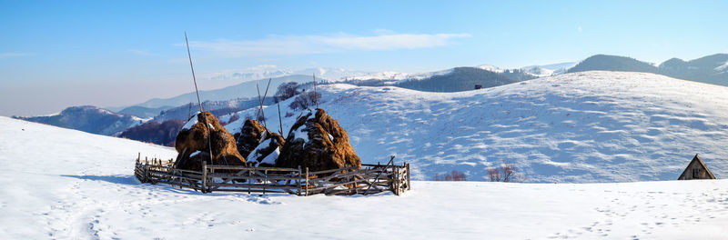 Sun over the winter mountains with snow, cindrel mountains, paltinis, romania