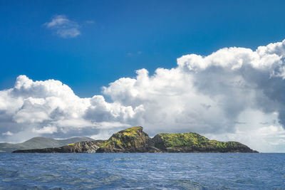 Rough irish coastline, kerry cliffs, seen from boat on atlantic ocean, ring of kerry, ireland