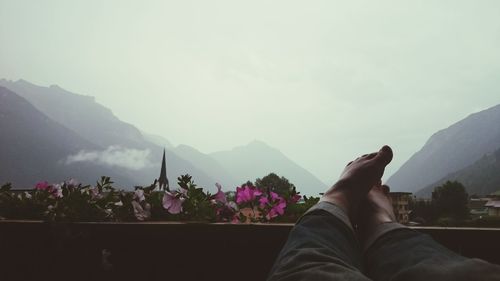 Close-up of woman looking at mountain landscape