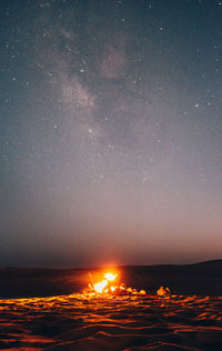 Scenic view of sea against sky at night