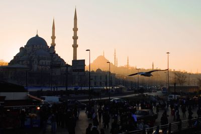 Panoramic view of buildings against sky at sunset