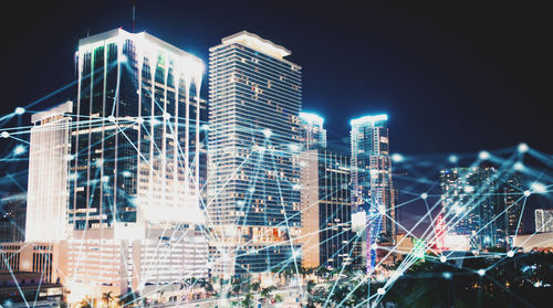 Illuminated buildings in city at night