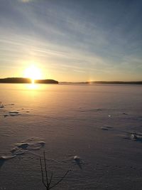 Scenic view of sea against sky at sunset