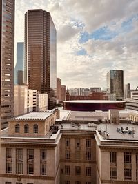 Buildings in city against sky