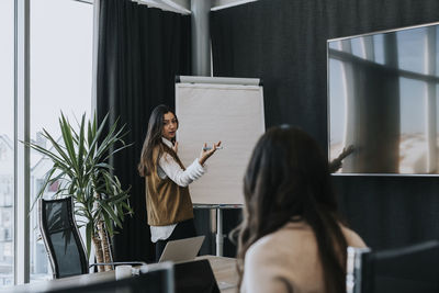 Female coworkers in boardroom