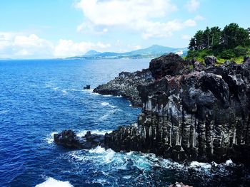 Scenic view of sea against blue sky