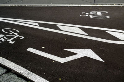 High angle view of arrow symbol on road