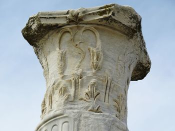 Low angle view of statue against sky