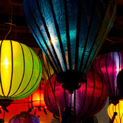 Low angle view of illuminated lanterns hanging on ceiling