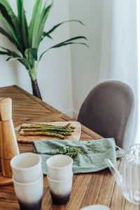 Asparagus on a cutting board on a table